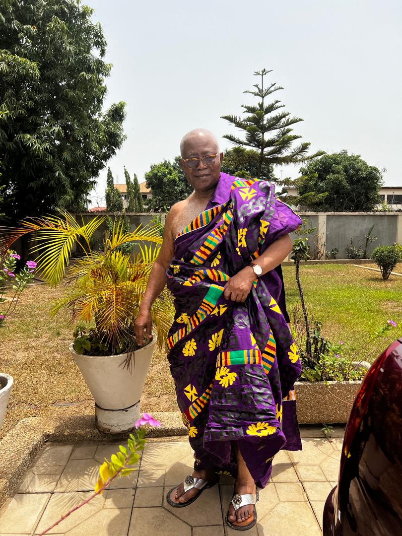 In purple Kente regalia